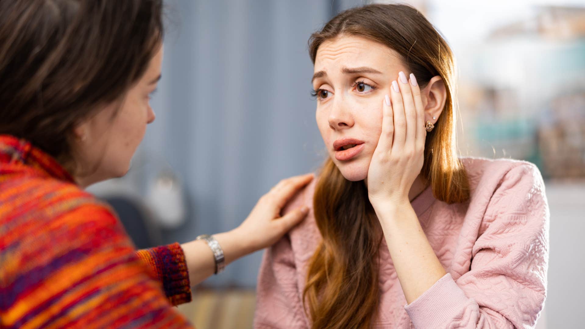kind and empathetic woman comforting friend