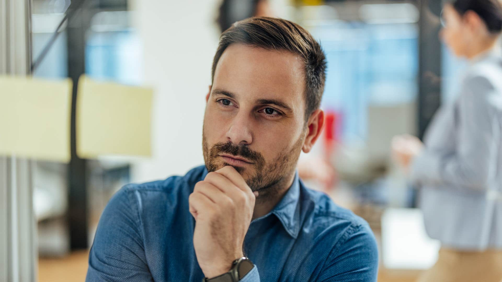 introspective man deep in thought