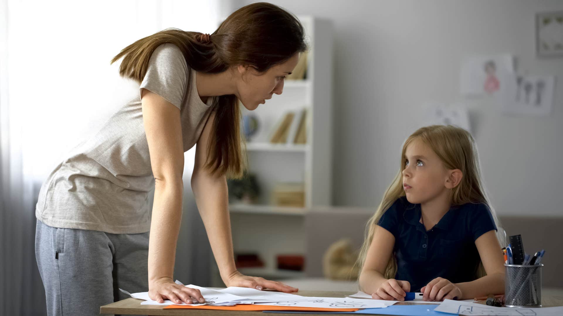strict mom criticizing daughter for being too shy