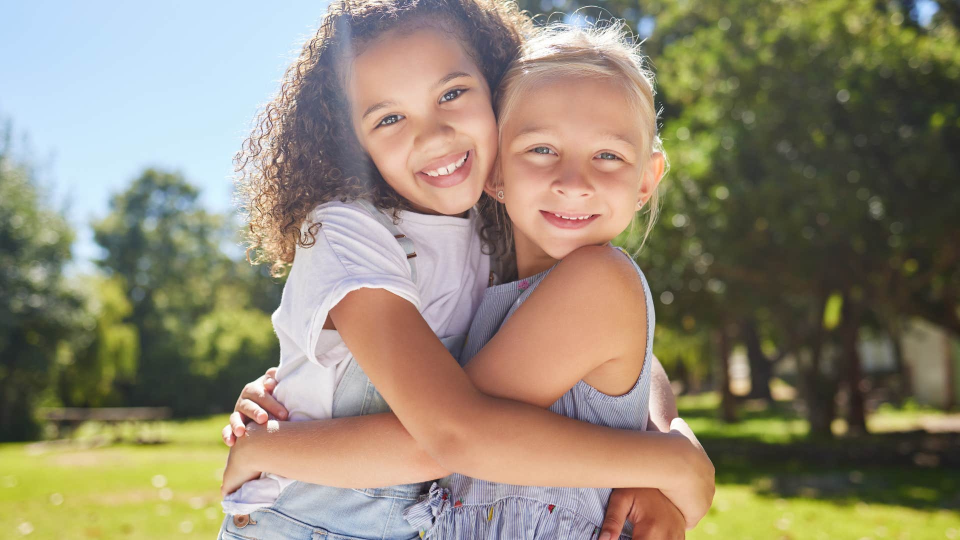 little girls hugging being best friends