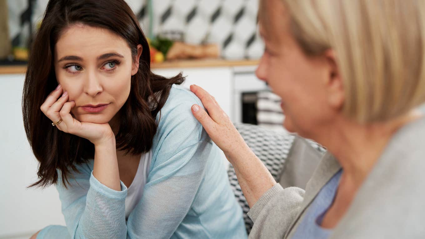 mom talking to annoyed daughter