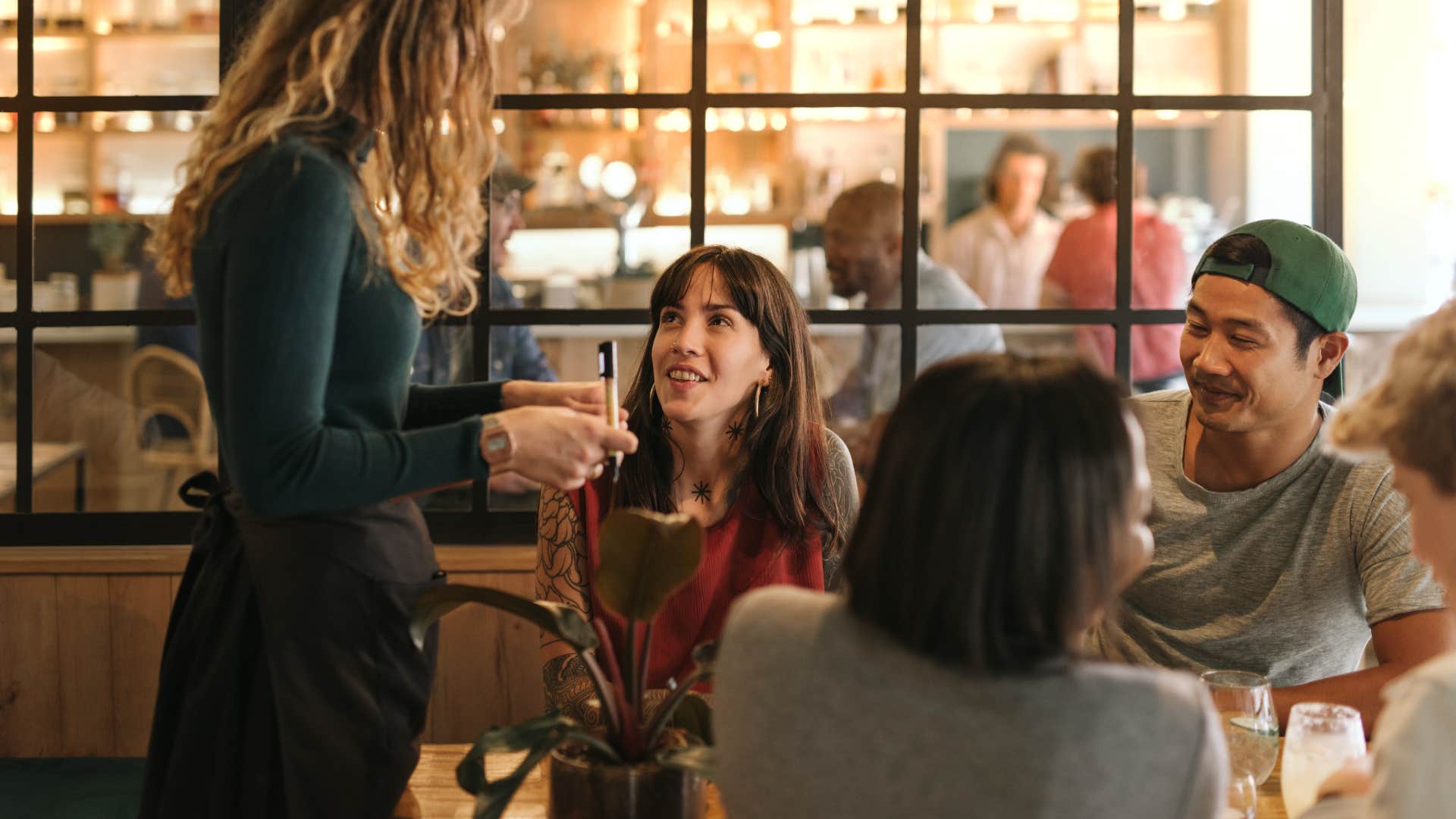 woman Rushing the meal to “help the server” which is a polite going out to dinner habit that is actually disrespectful 