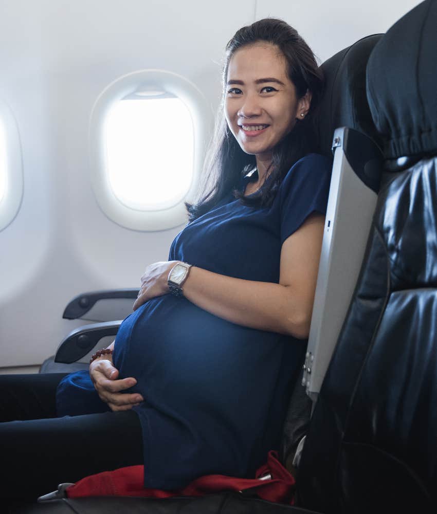 pregnant woman flying on plane