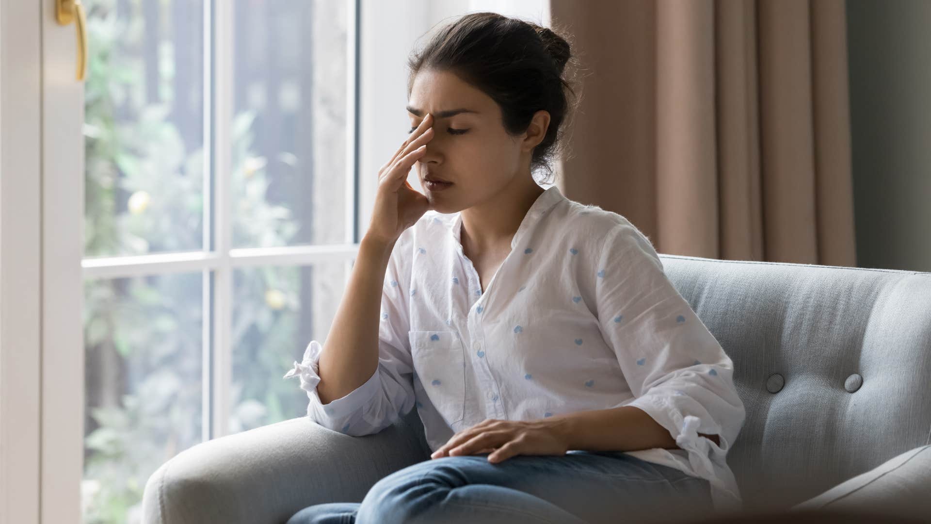 woman exhausted from emotional labor with friends
