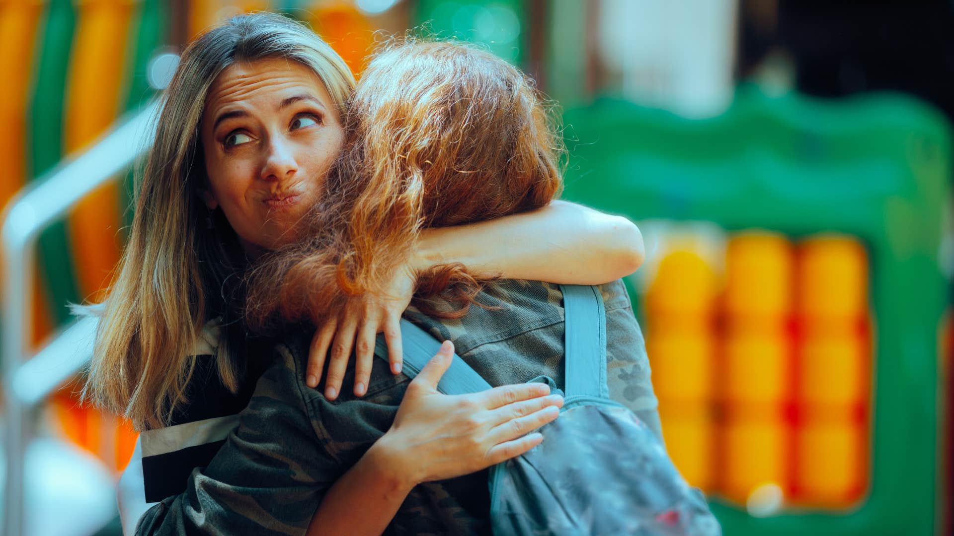 woman hugging friend not wanting to engage in competition