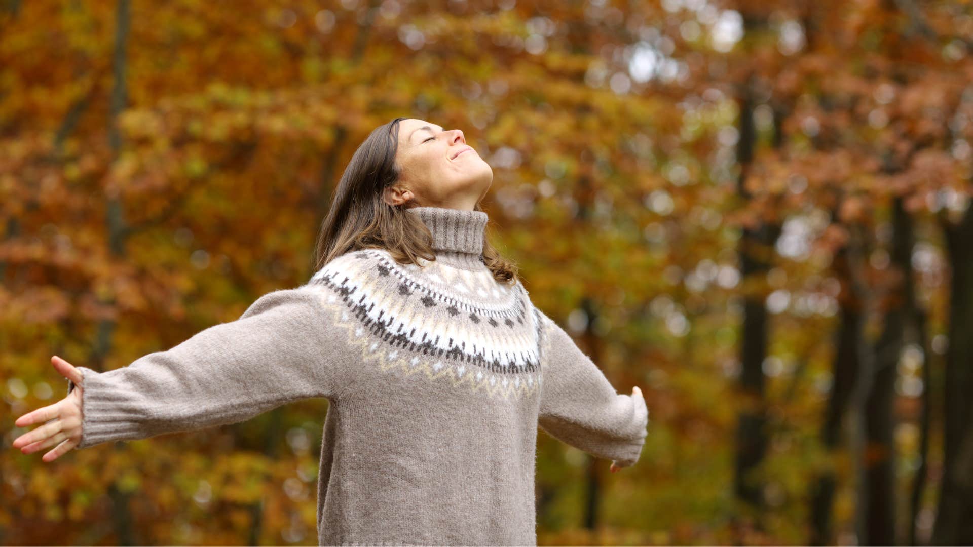 woman feeling free standing outside