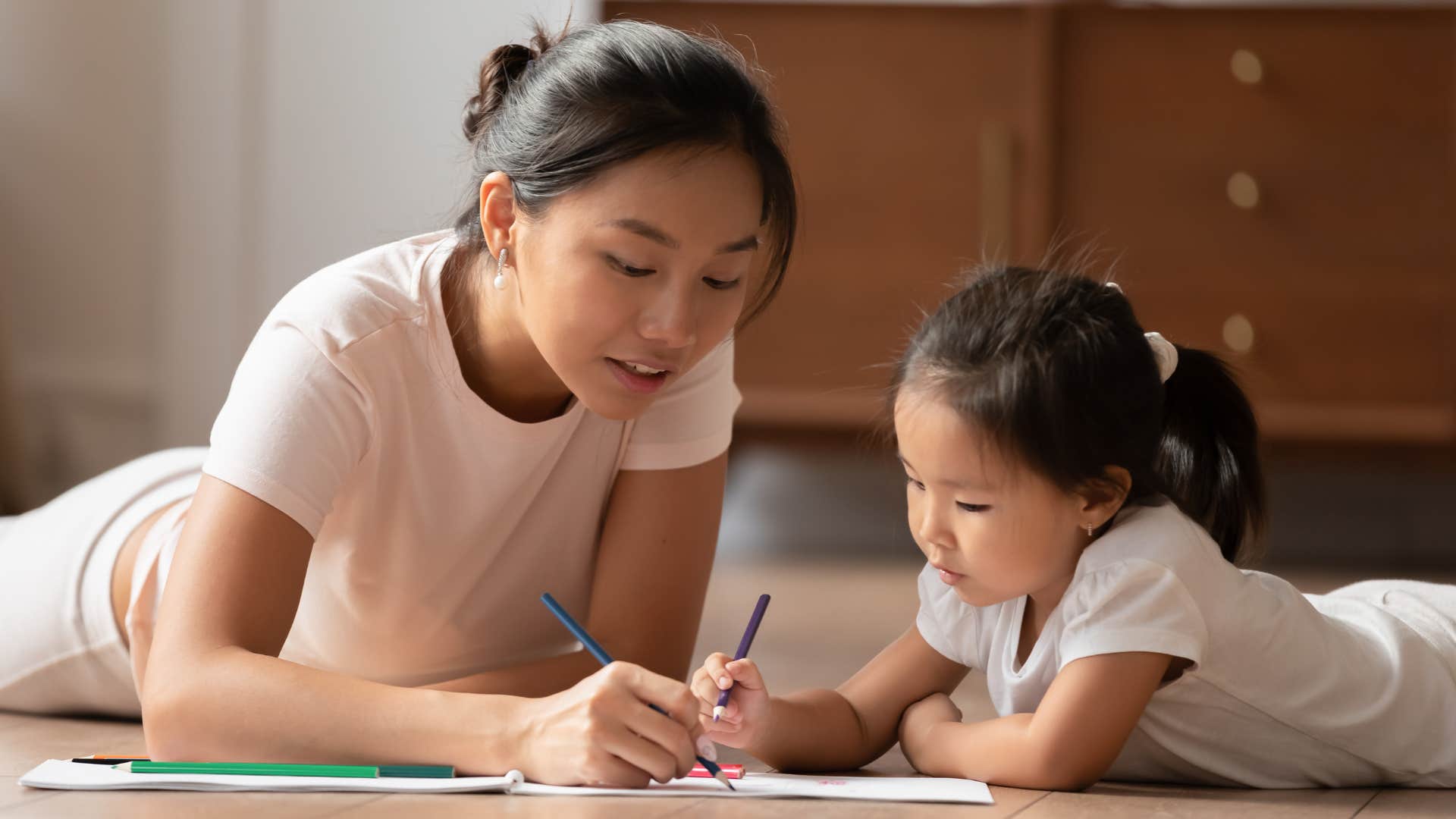 nanny acting as a role model to little girl