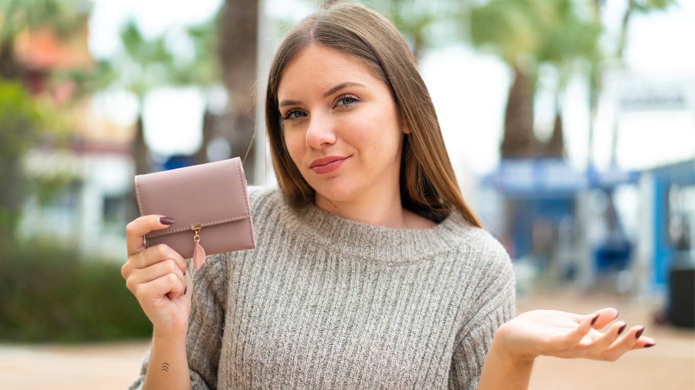 If You Refuse To Waste A Dollar, You'll Always Say These Things Out Loud cheap woman holding wallet not wanting to spend money