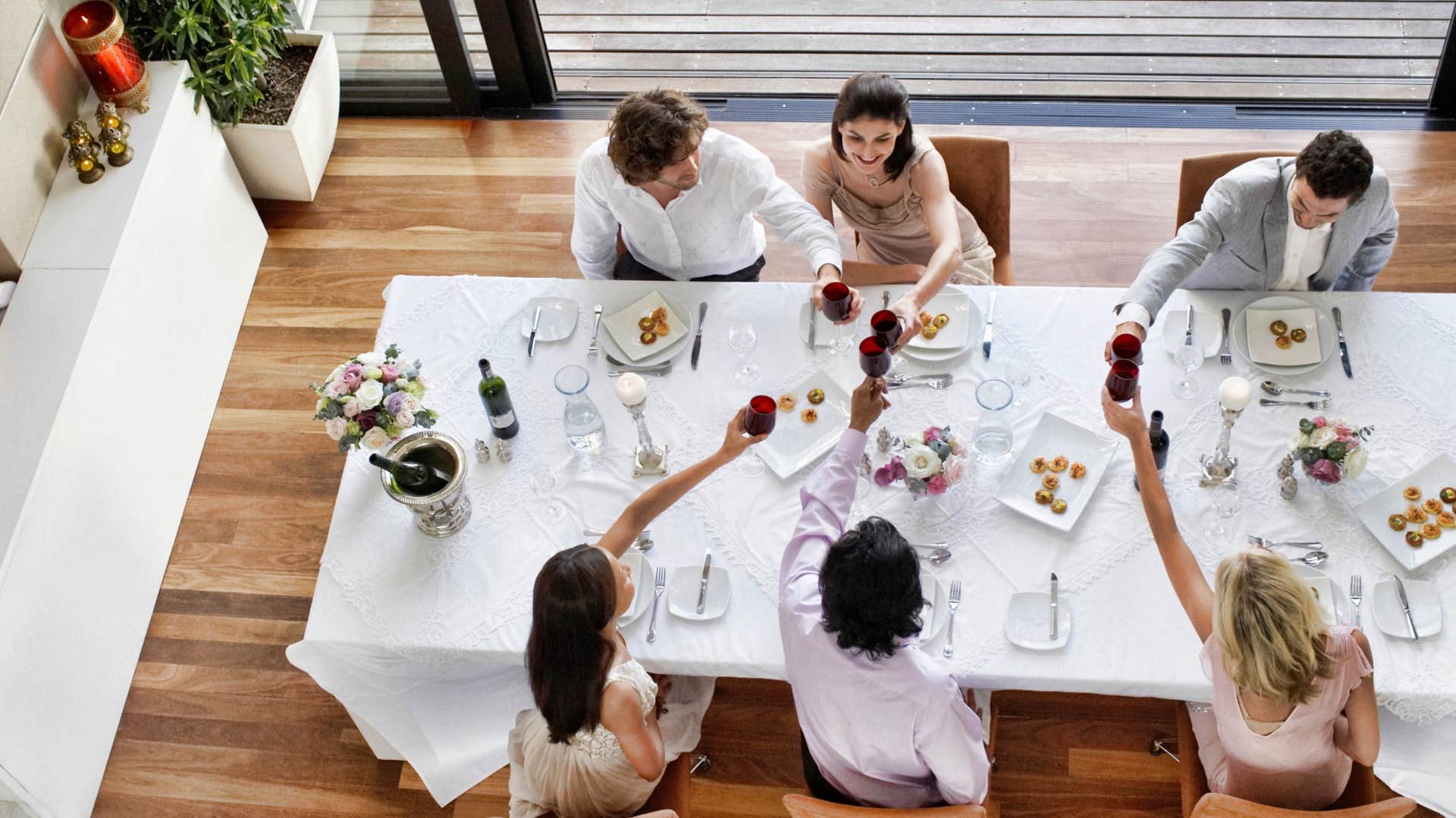 group of high society friends sitting in formal setting