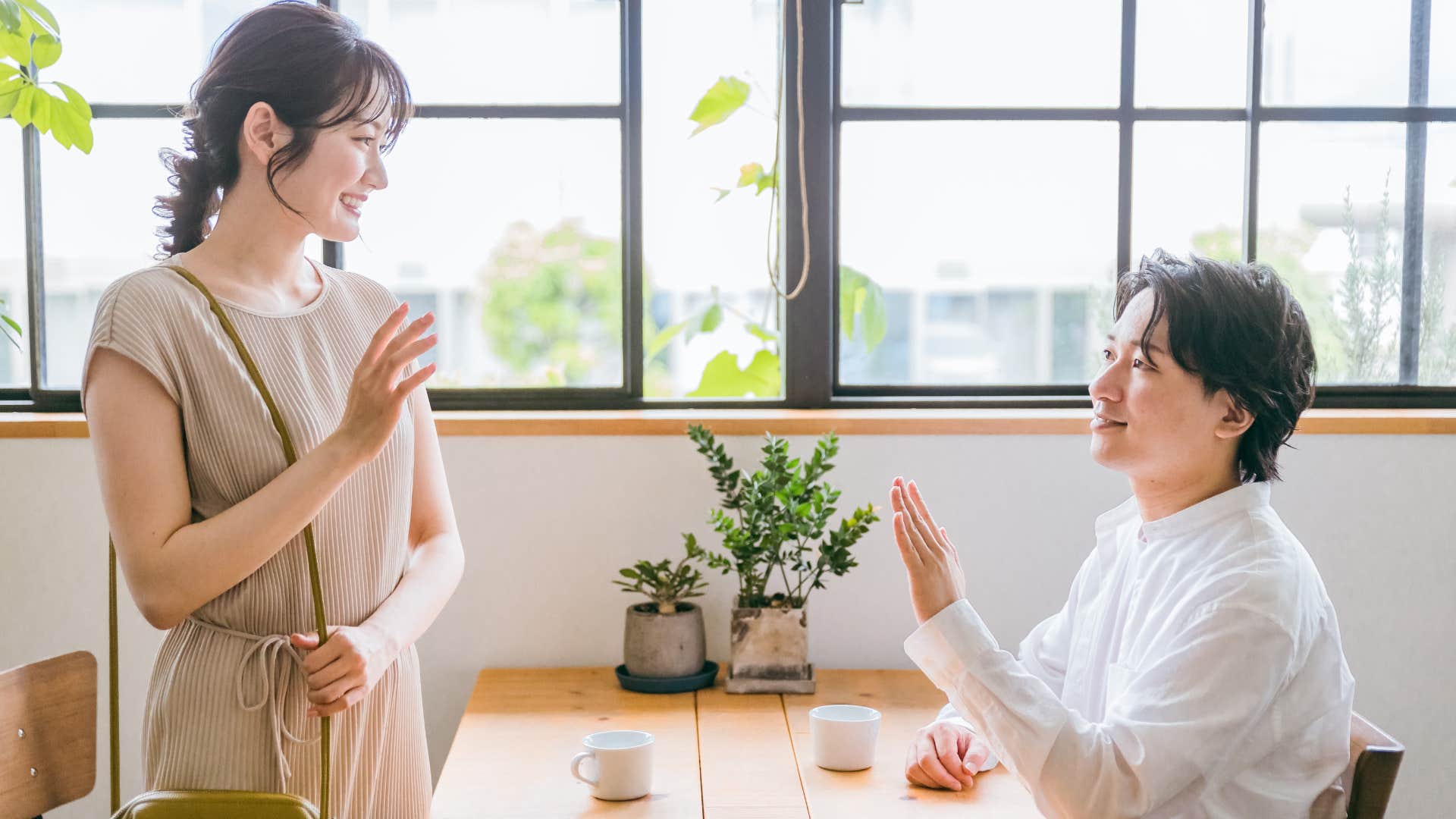woman being polite exiting table with friend