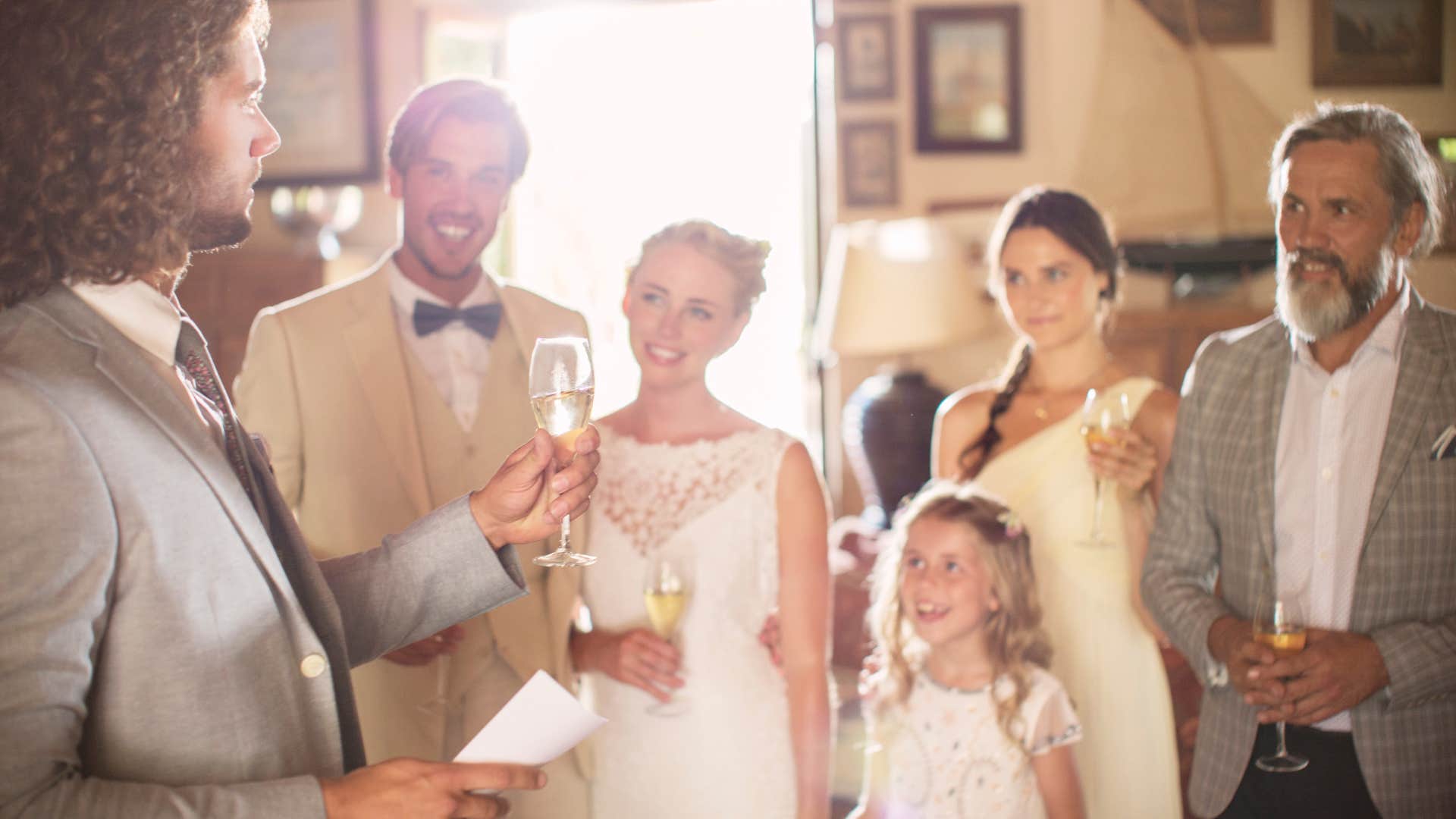 bride and groom toasting at wedding