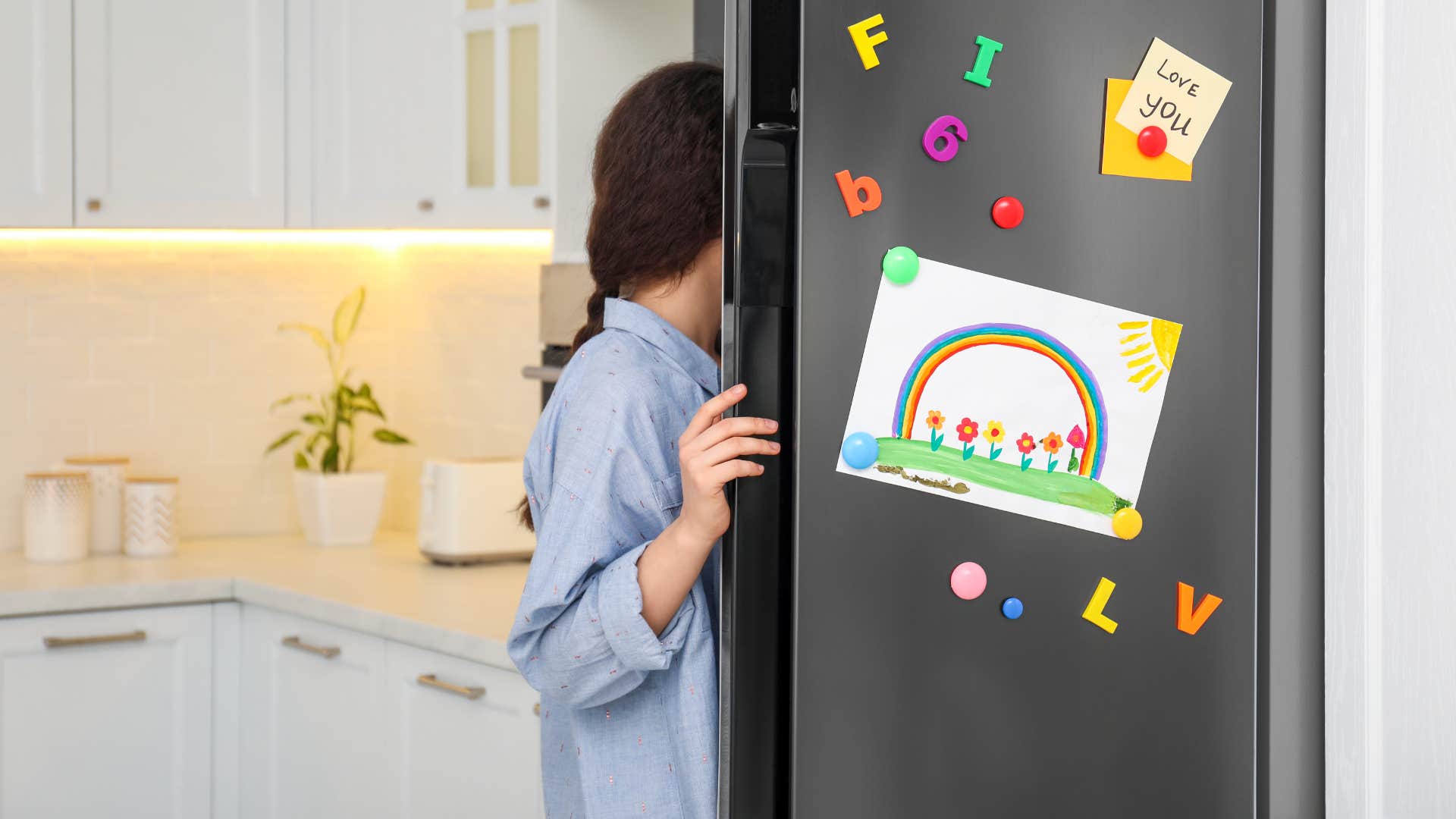 woman opening fridge with fridge magnets showing