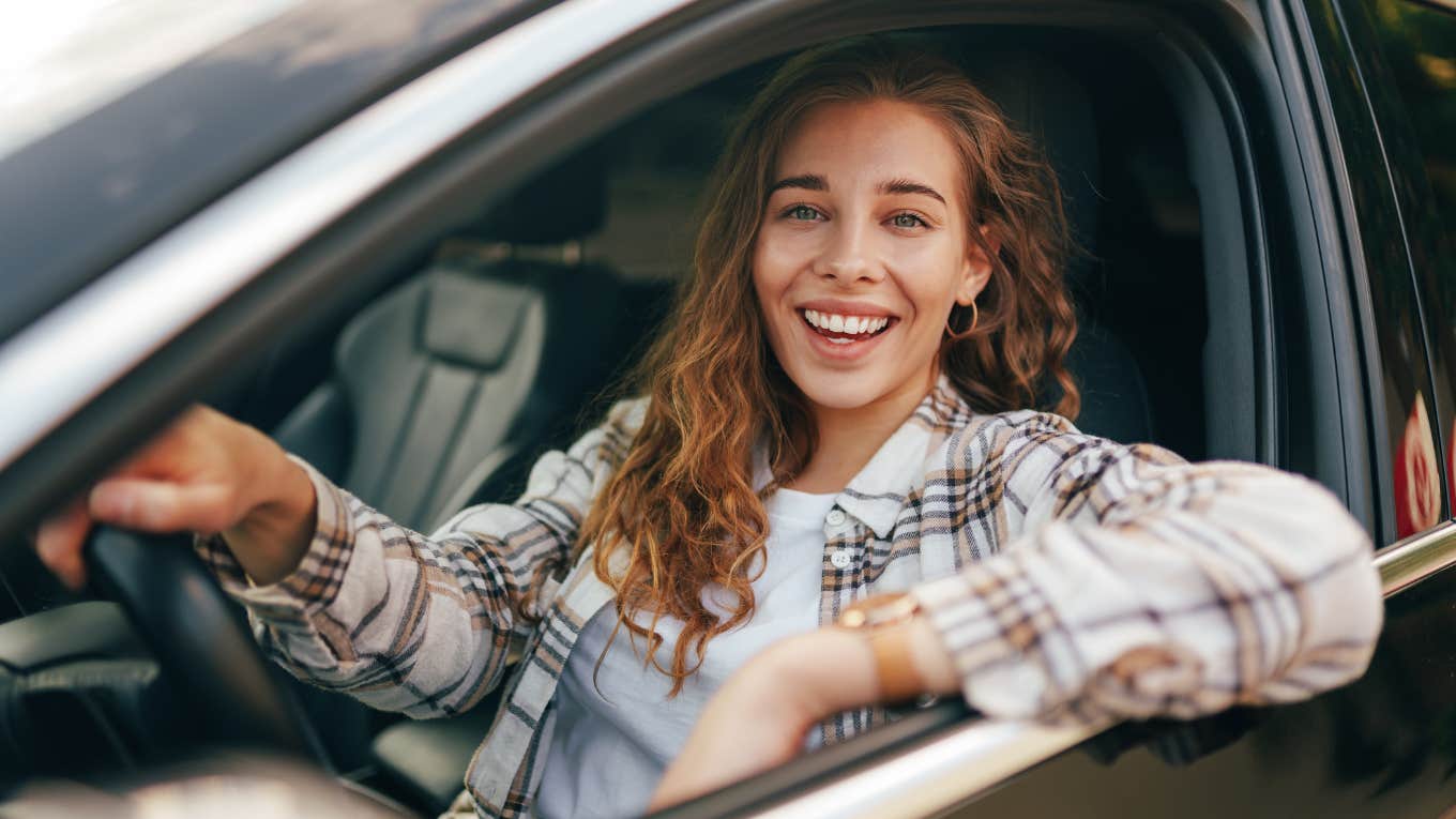 If You See These Things In A Woman's Car, You Know She Takes Excellent Care Of Herself happy healthy woman smiling in her car