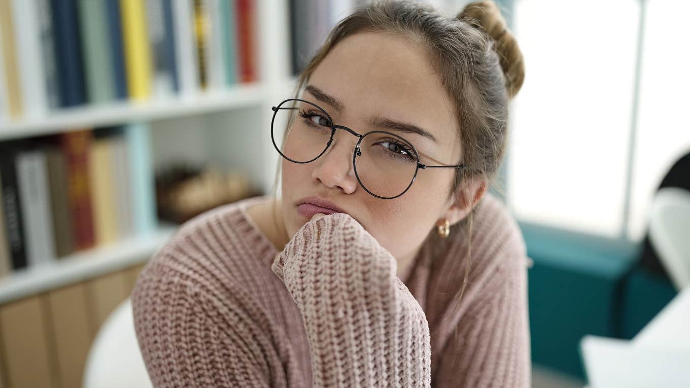 stressed and confused college student in the library