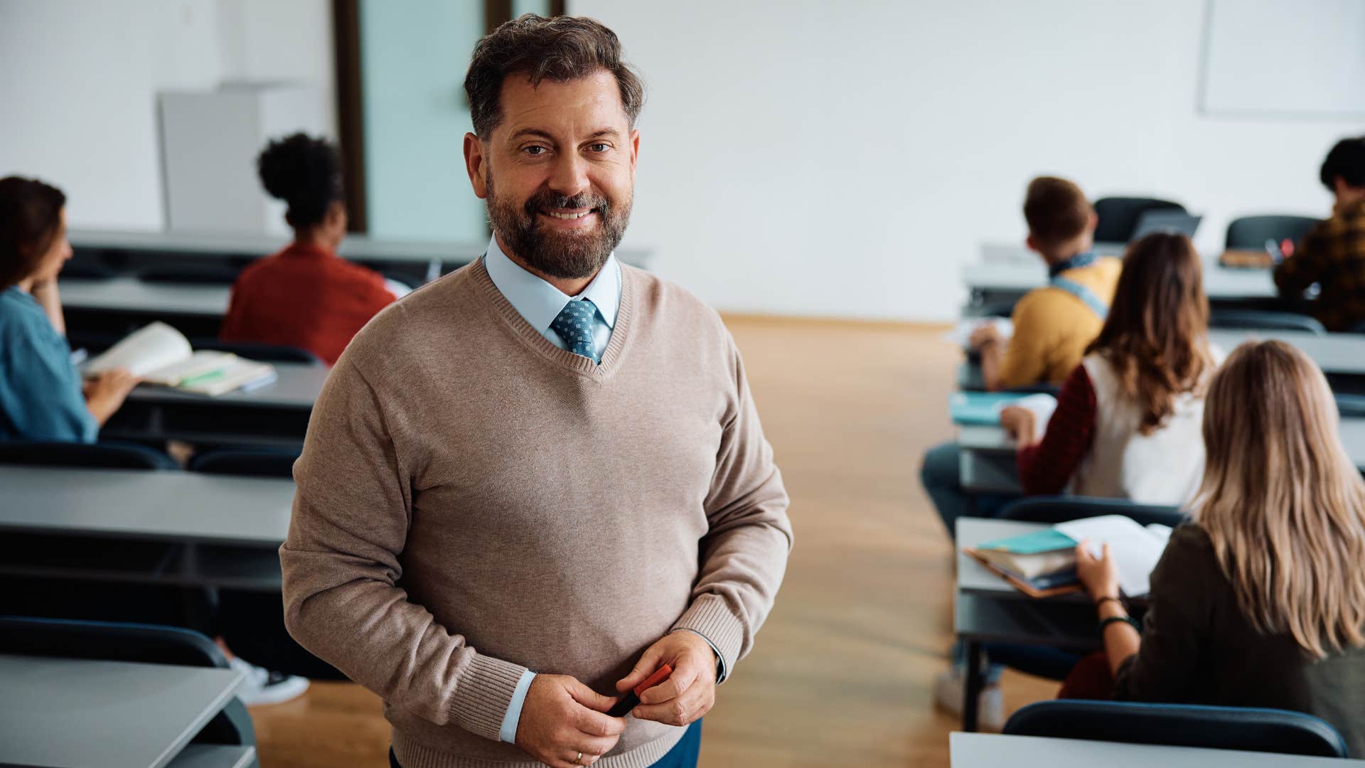 college professor with a full classroom of students