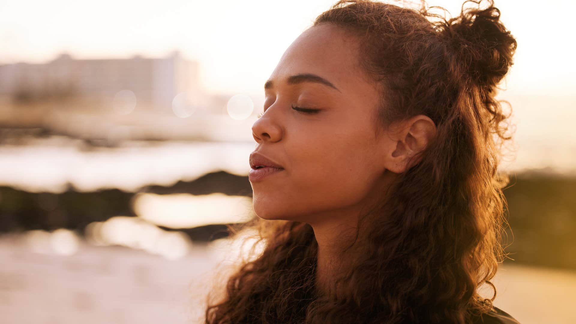 woman who's calm in chaotic situations taking a deep breath