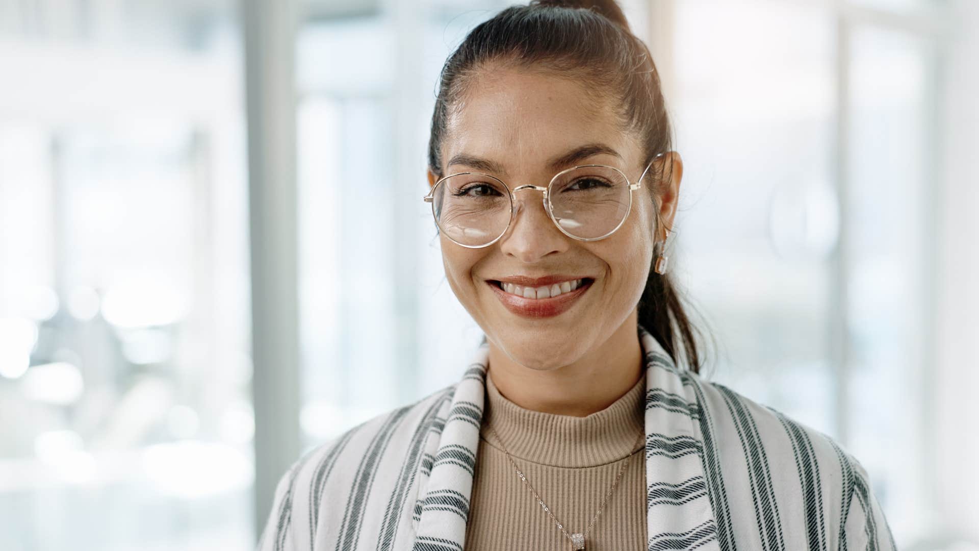 woman who has a strong sense of purpose smiling