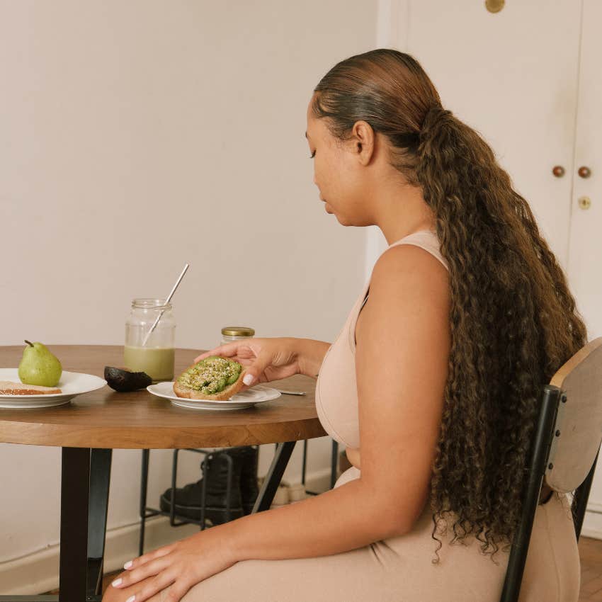 woman experiencing changes appetite signs eclipse season sickness