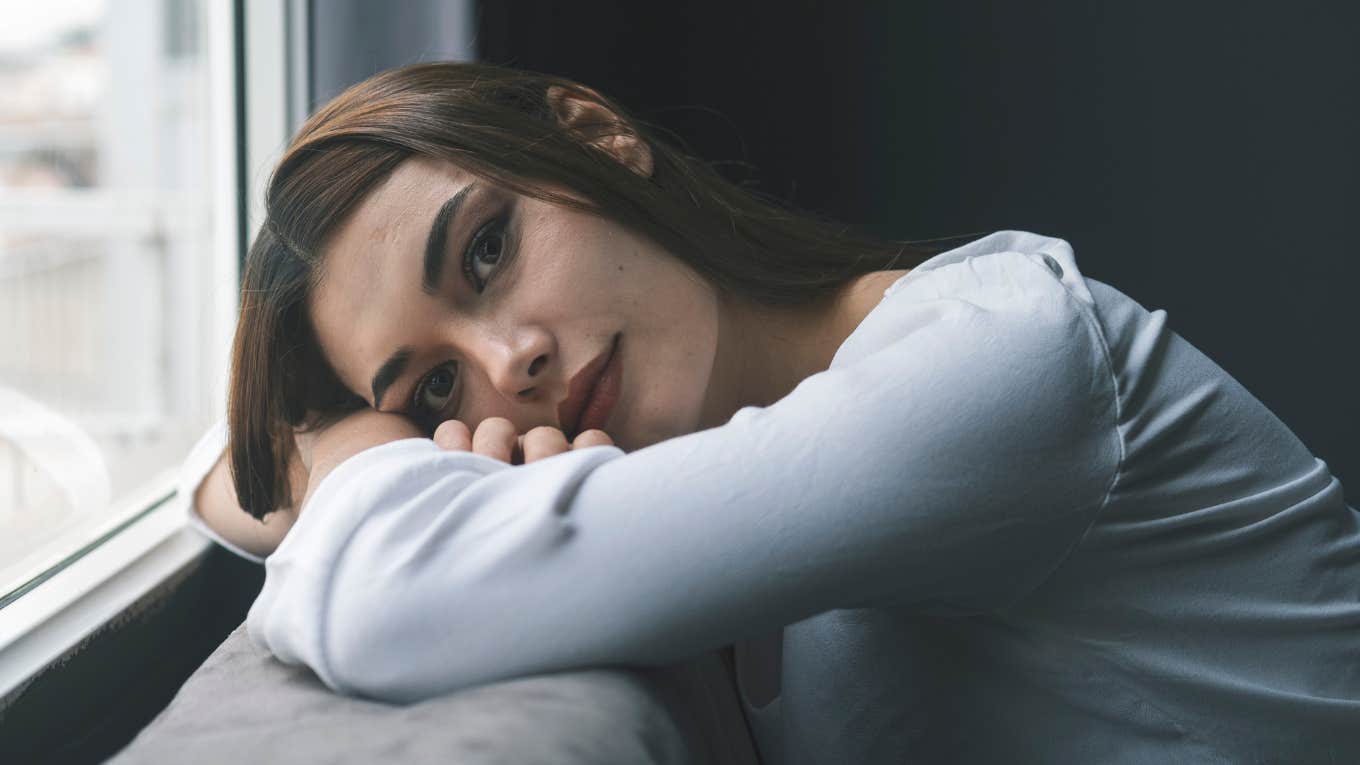 lone wolf woman sitting at home alone