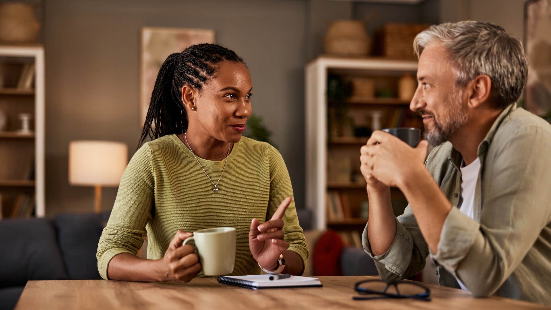 young woman having meaningful conversation with older friend