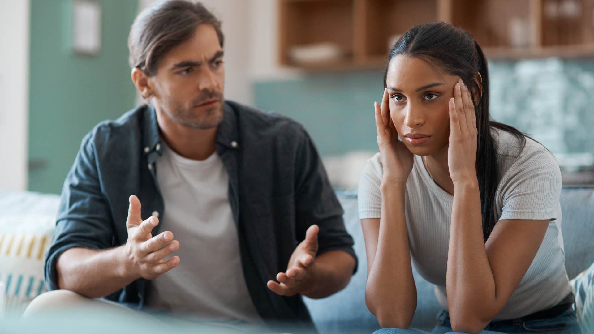 Woman turned away from her husband who can call out your vulnerabilities.