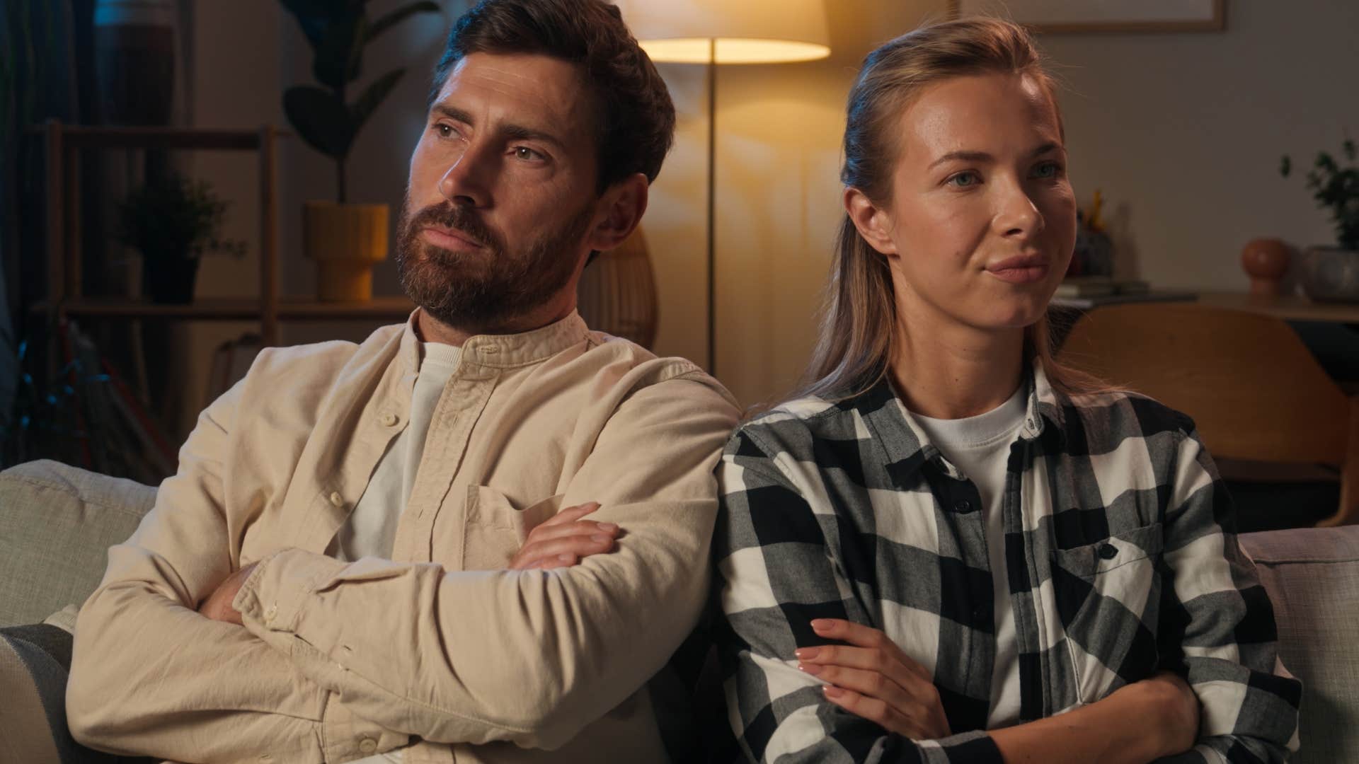 Woman sitting next to her upset husband who never apologizes.