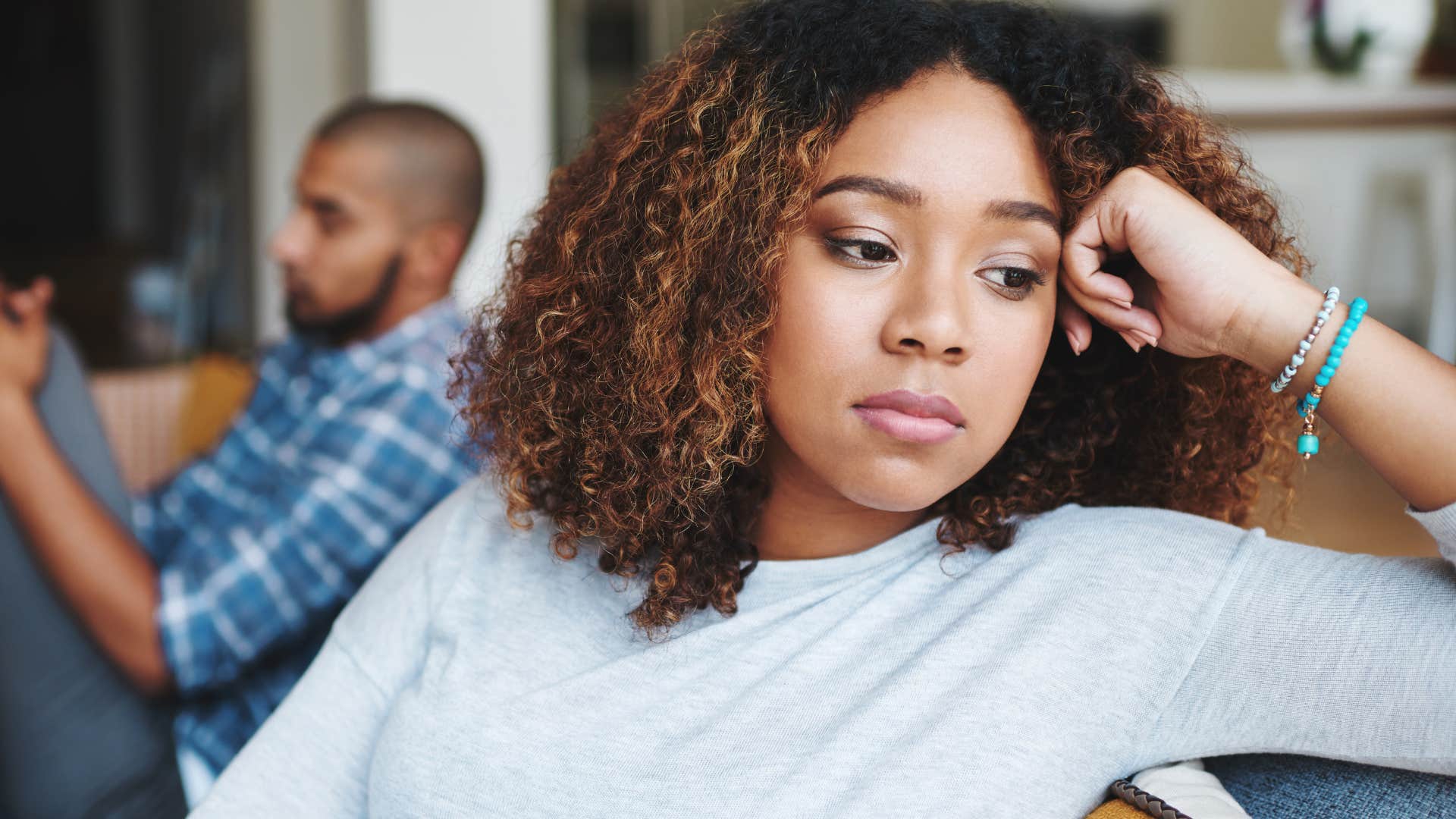 Man who withholds affection when he's upset turned away from his wife.