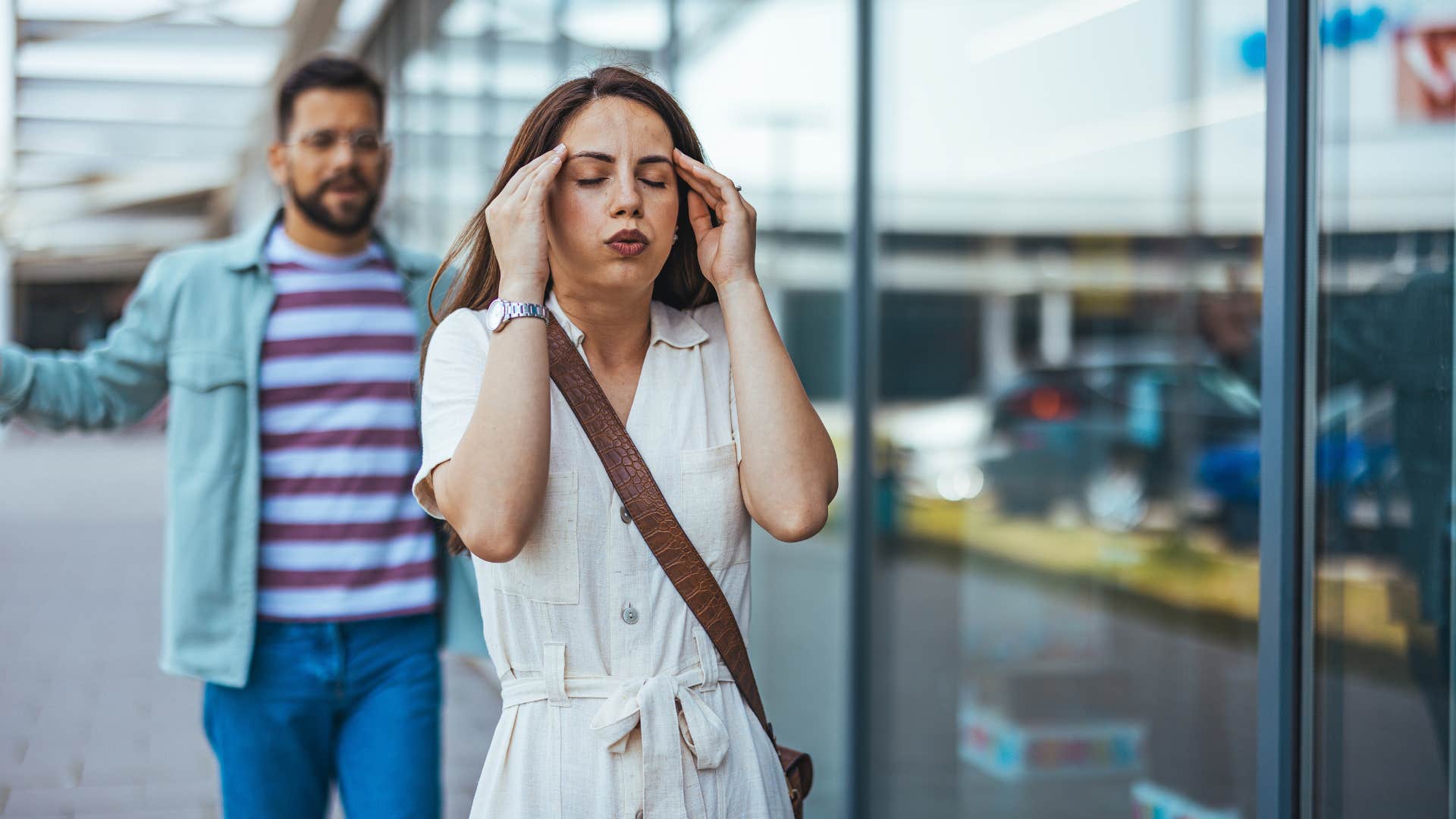 woman who is with partner who is not right for her as her gut tells her the relationship is over