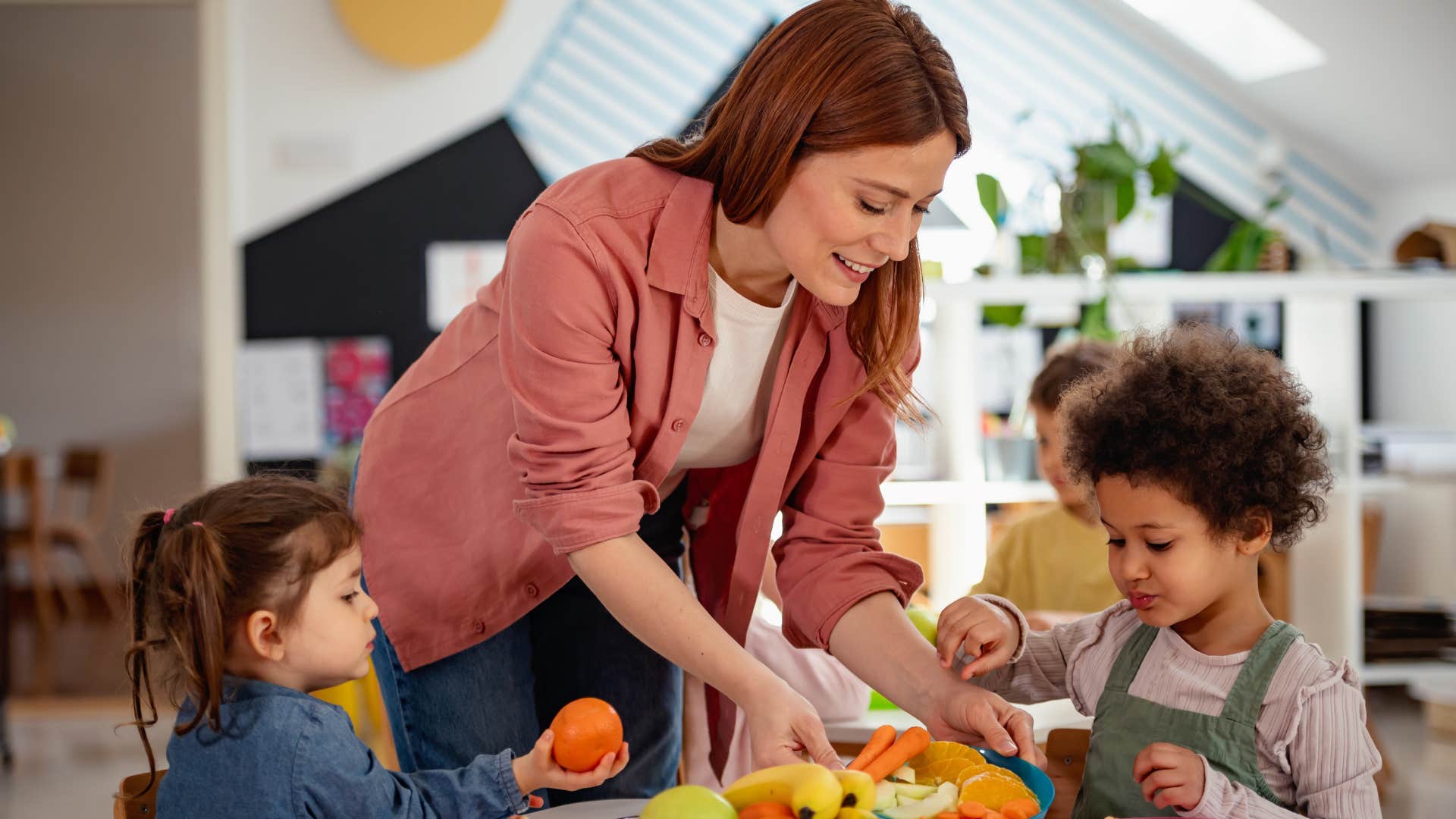 Woman who can afford childcare playing with kids.