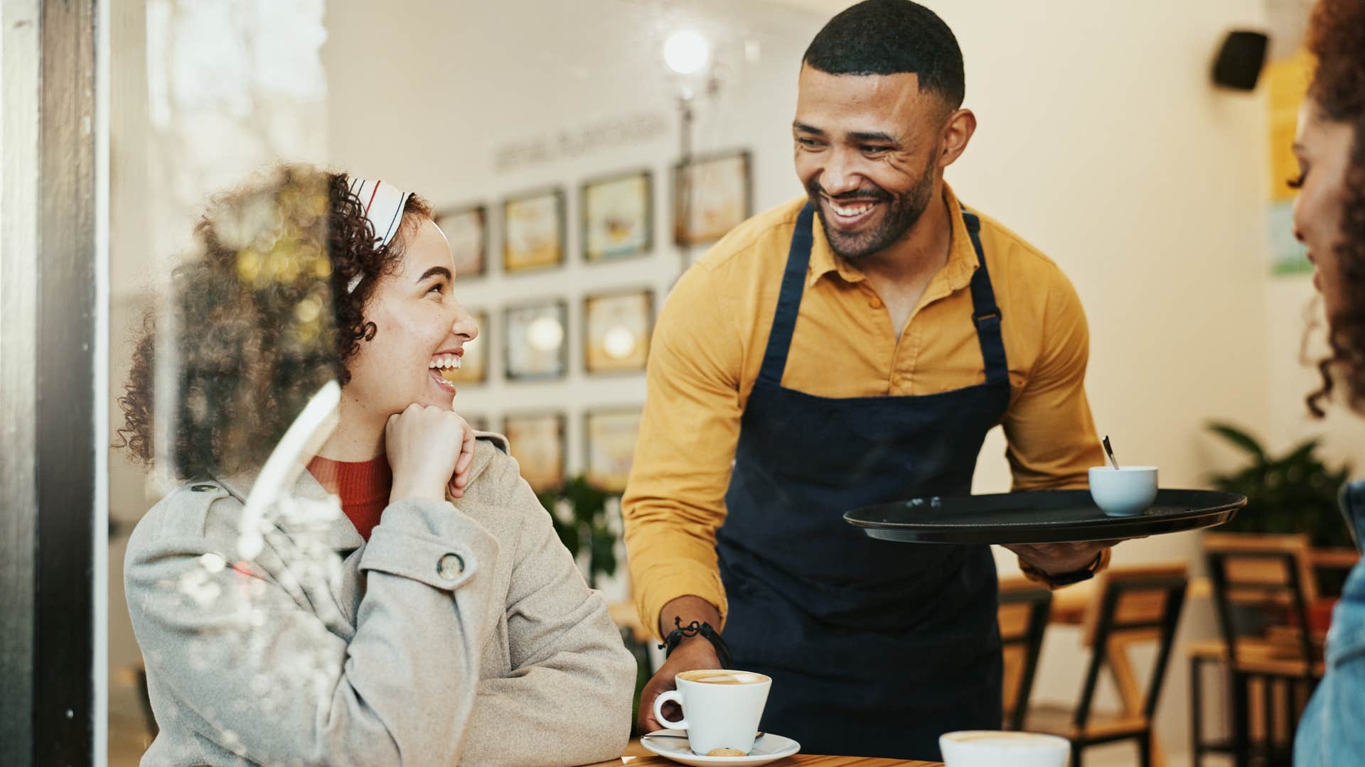 Woman who goes out for coffee every single day talking to a barista.