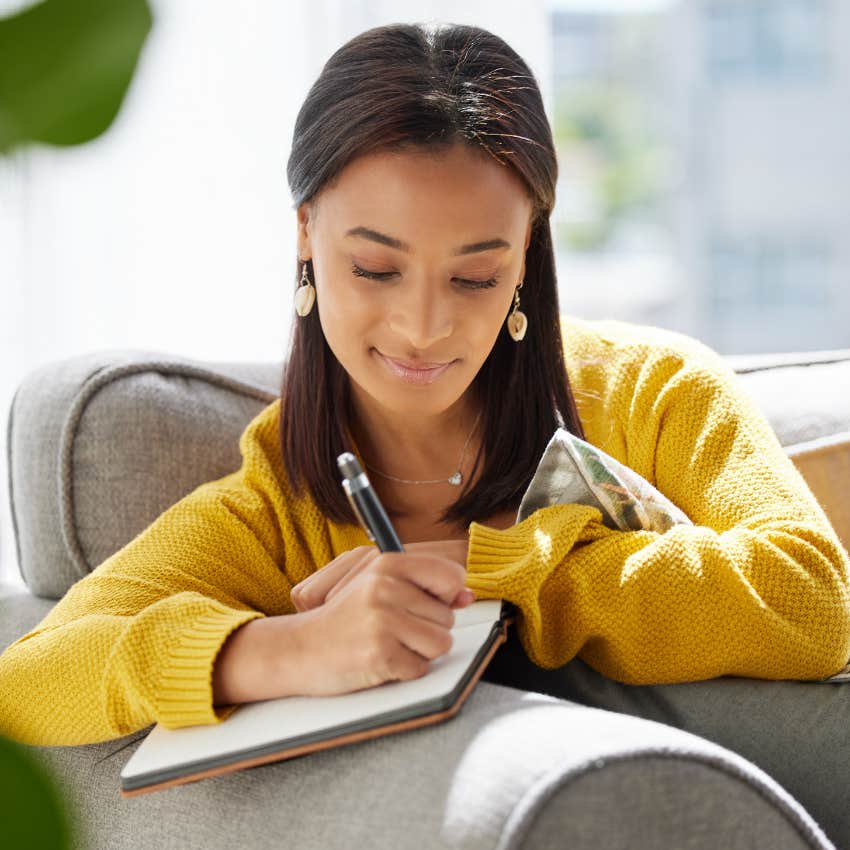 woman who is naturally aware journaling