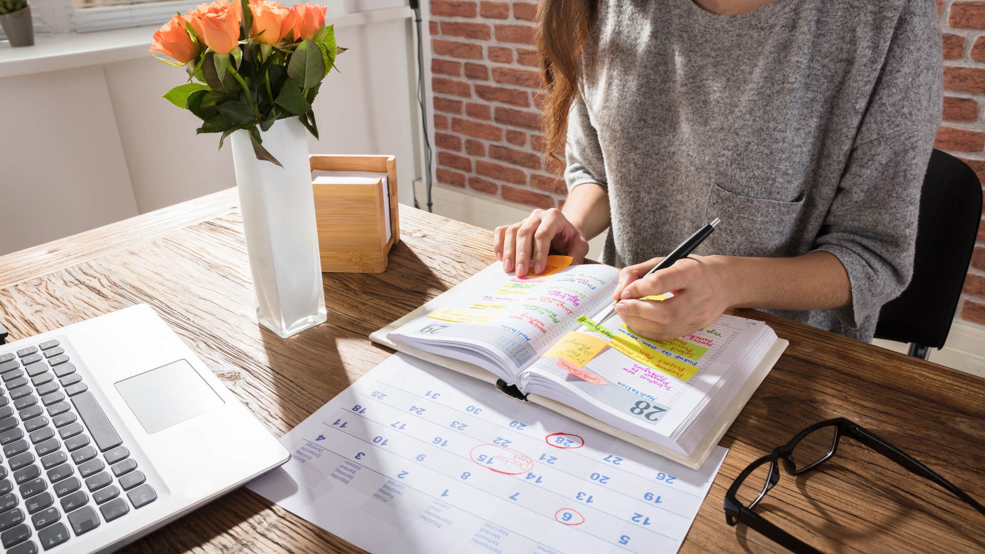 woman who is naturally grounded as she declutters calendar
