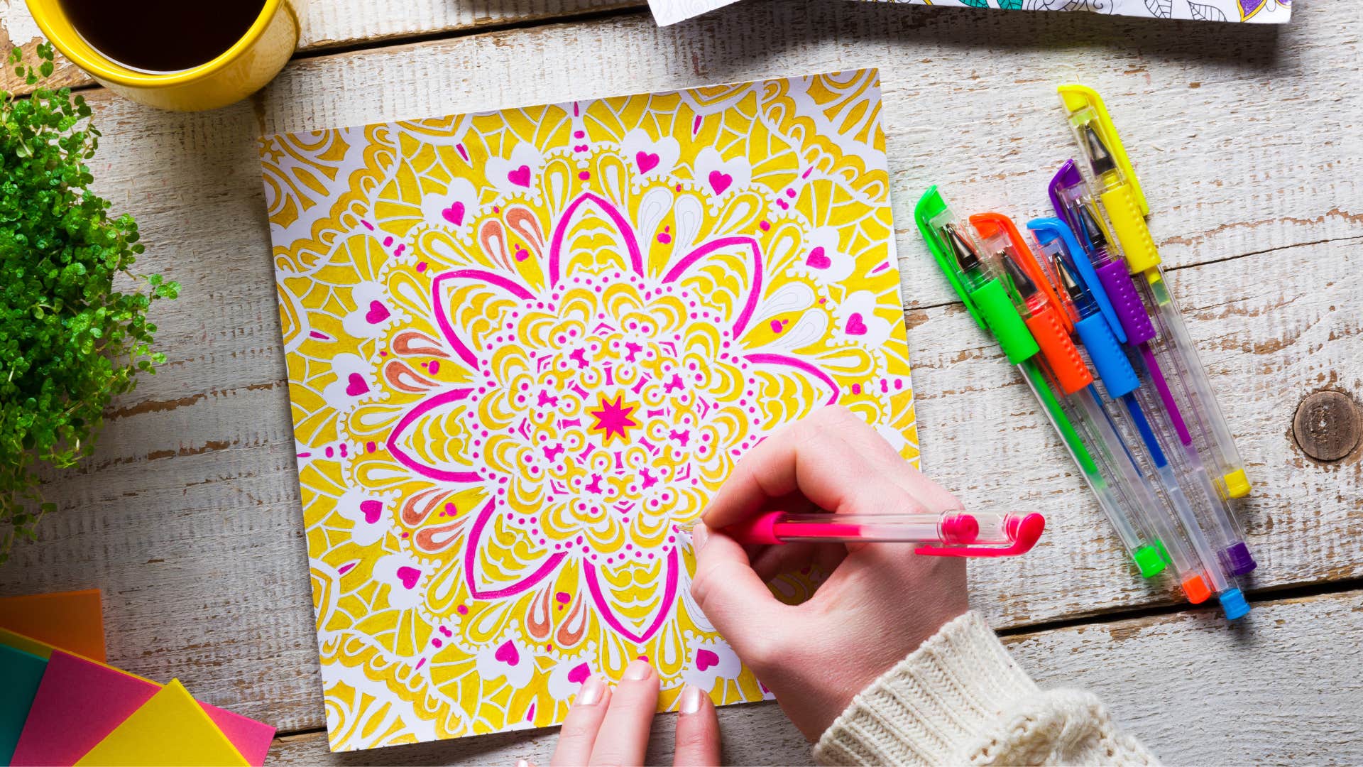 woman who is naturally peaceful with a coloring book