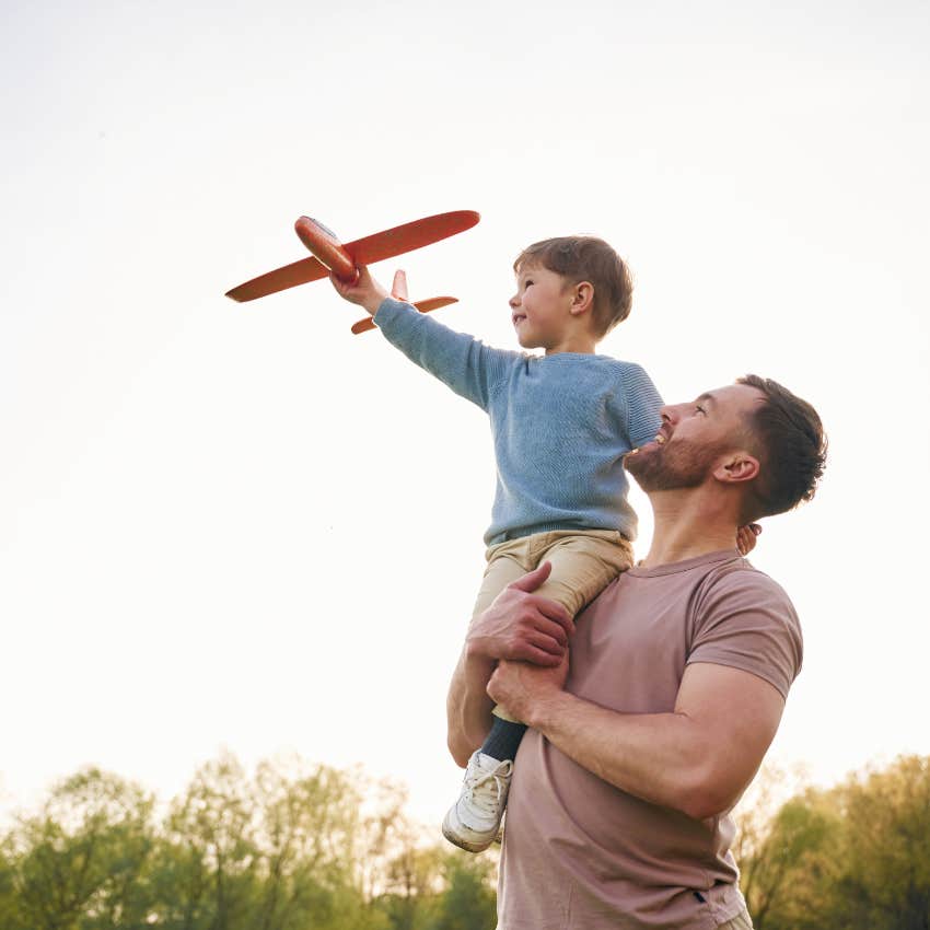 man who is naturally playful using a child as model