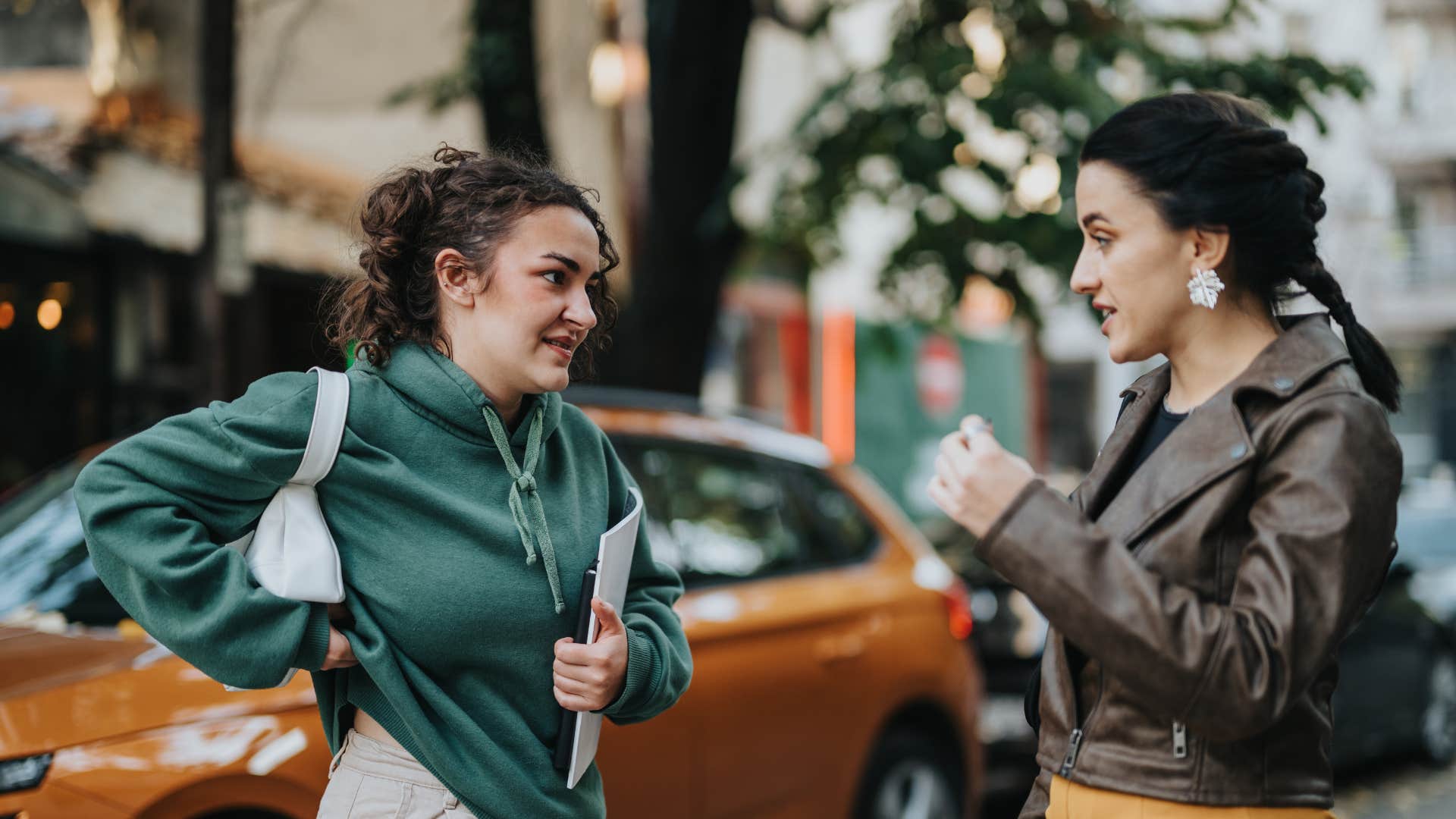 woman asking friend not to judge her for her messy car