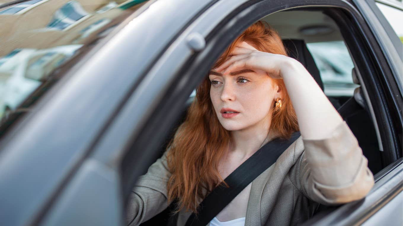 If Someone's Ashamed Of Their Car, They'll Always Say These Things Before You Get In woman sitting in car embarrassed by how it looks
