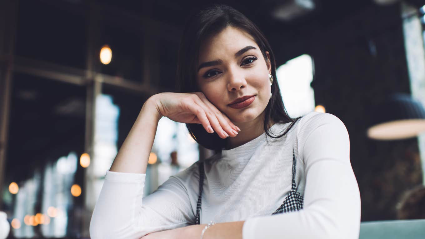 jealous judgmental woman looking annoyed and smug