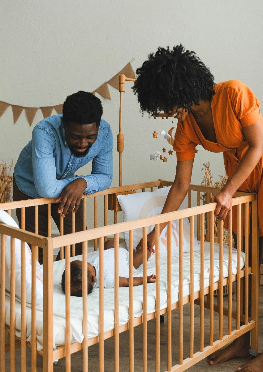 husband and wife with their infant child