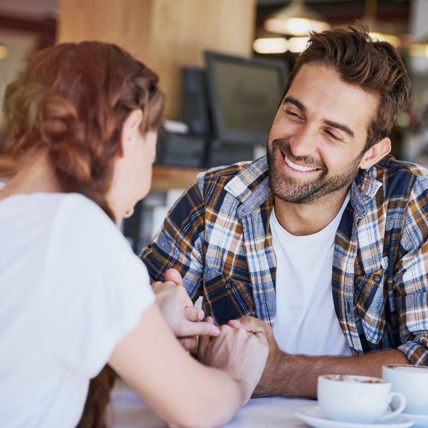 man who can't resist woman's energy as he makes eye contact with her