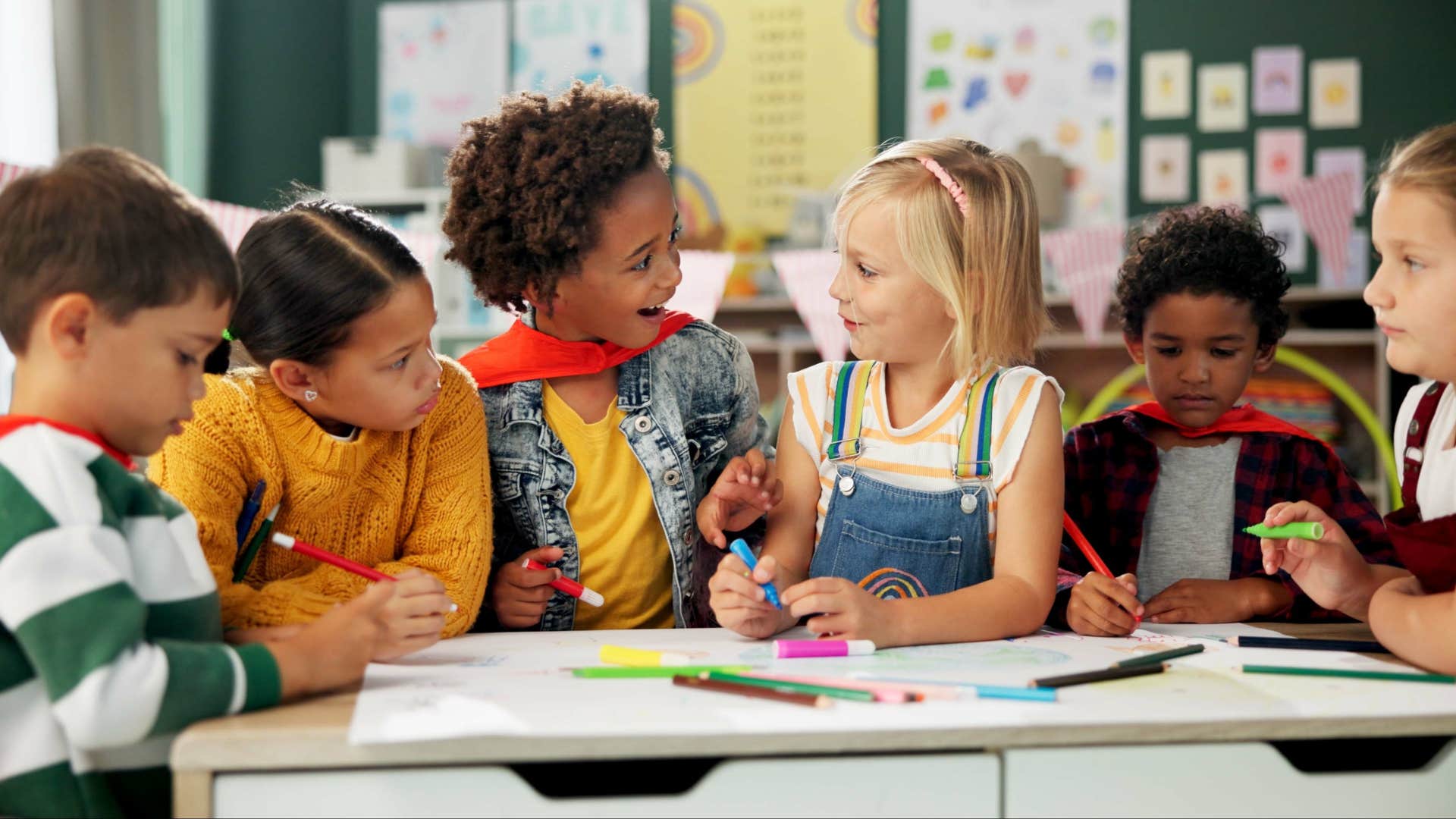 young students gathered around a table