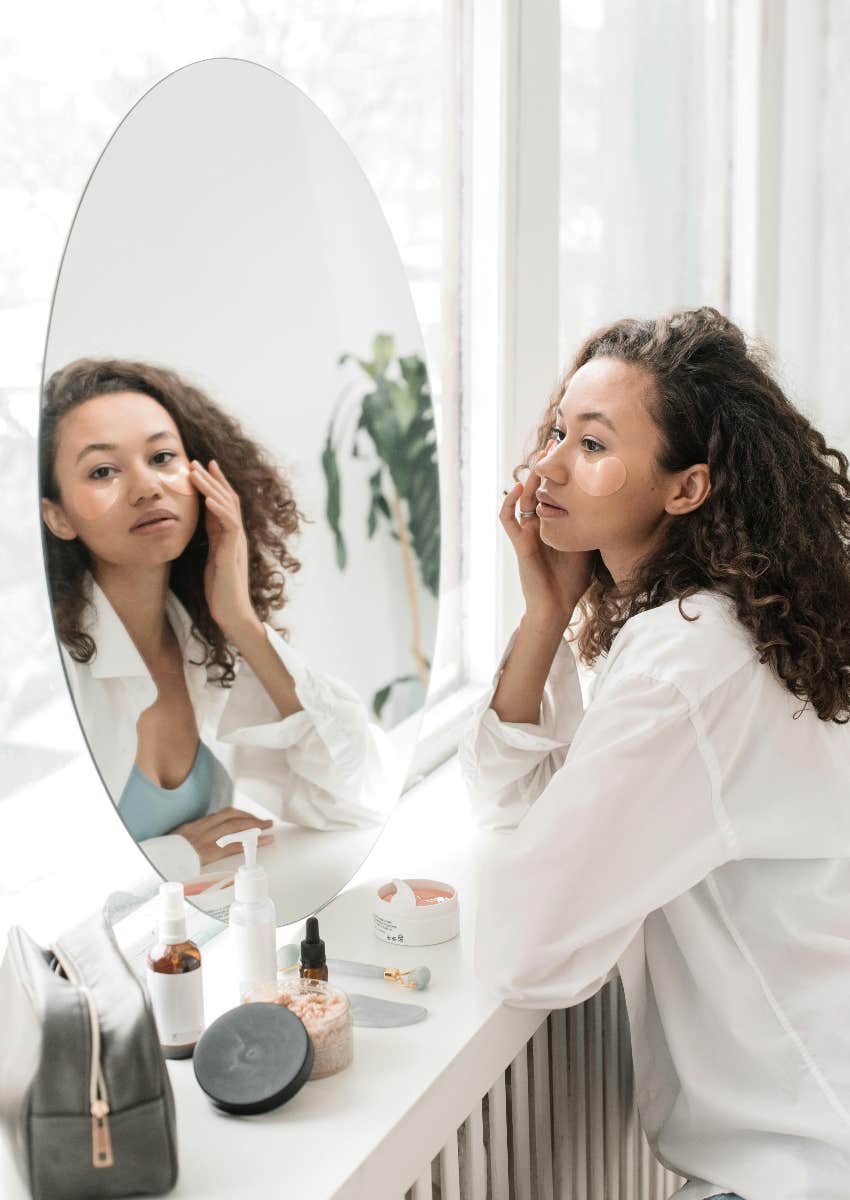 self-centered woman looking mirror