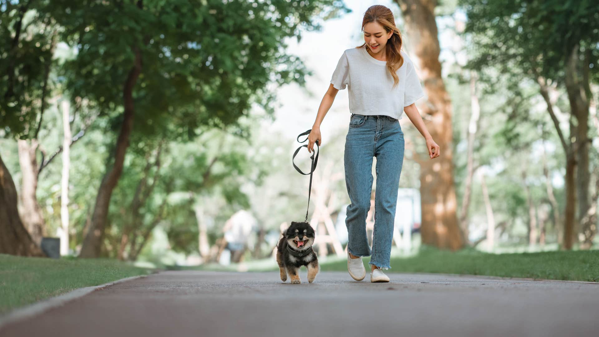 woman walking her dog in safe community