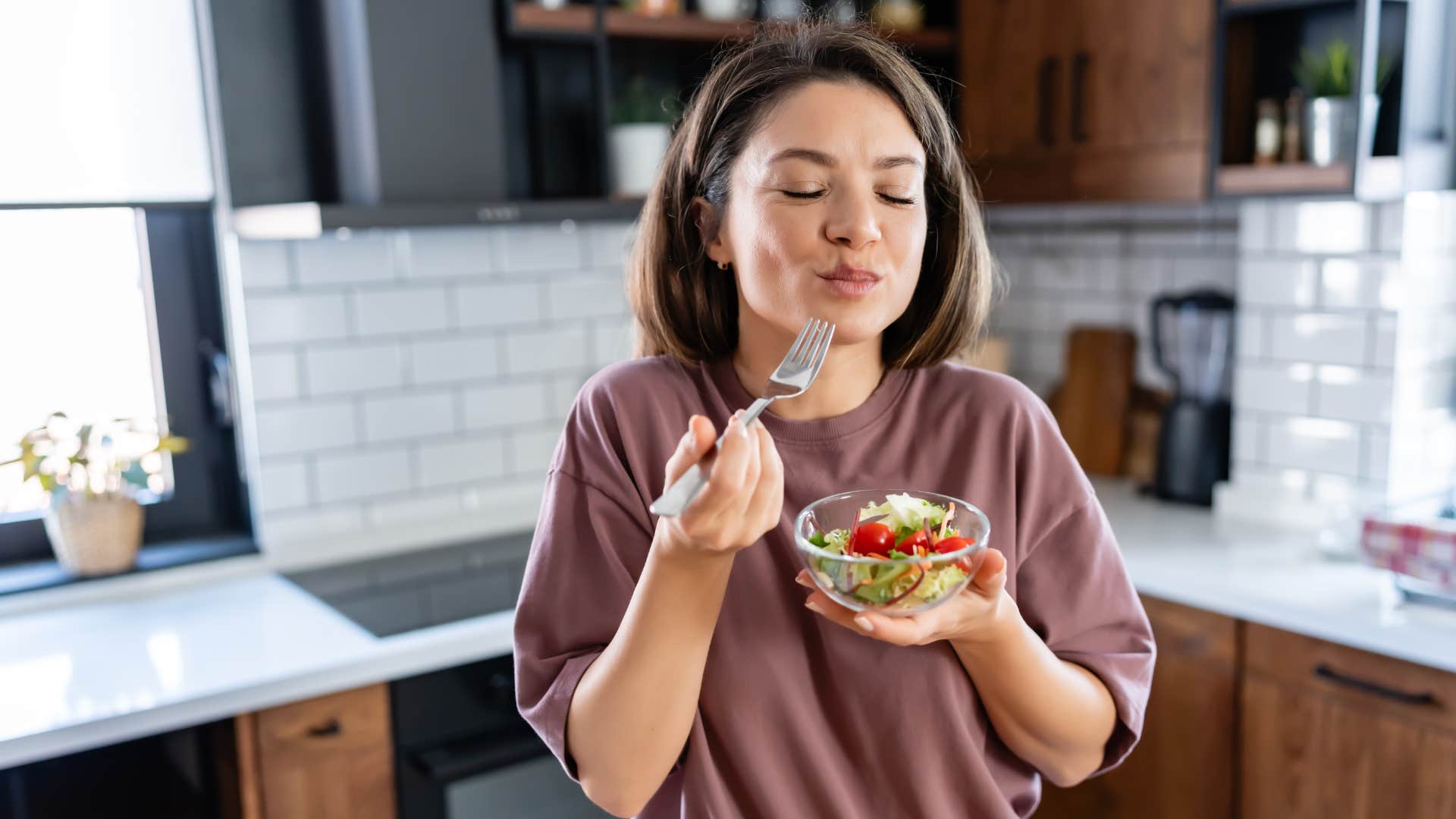 woman enjoying eating food