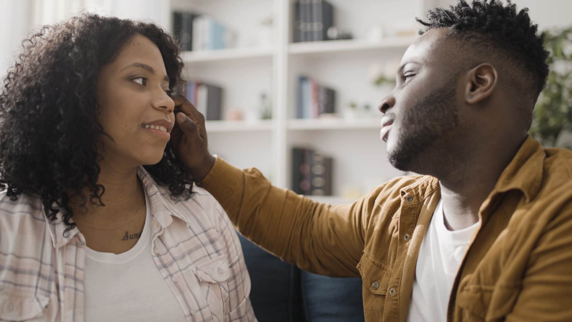 Woman looking at her husband and giving him grace.