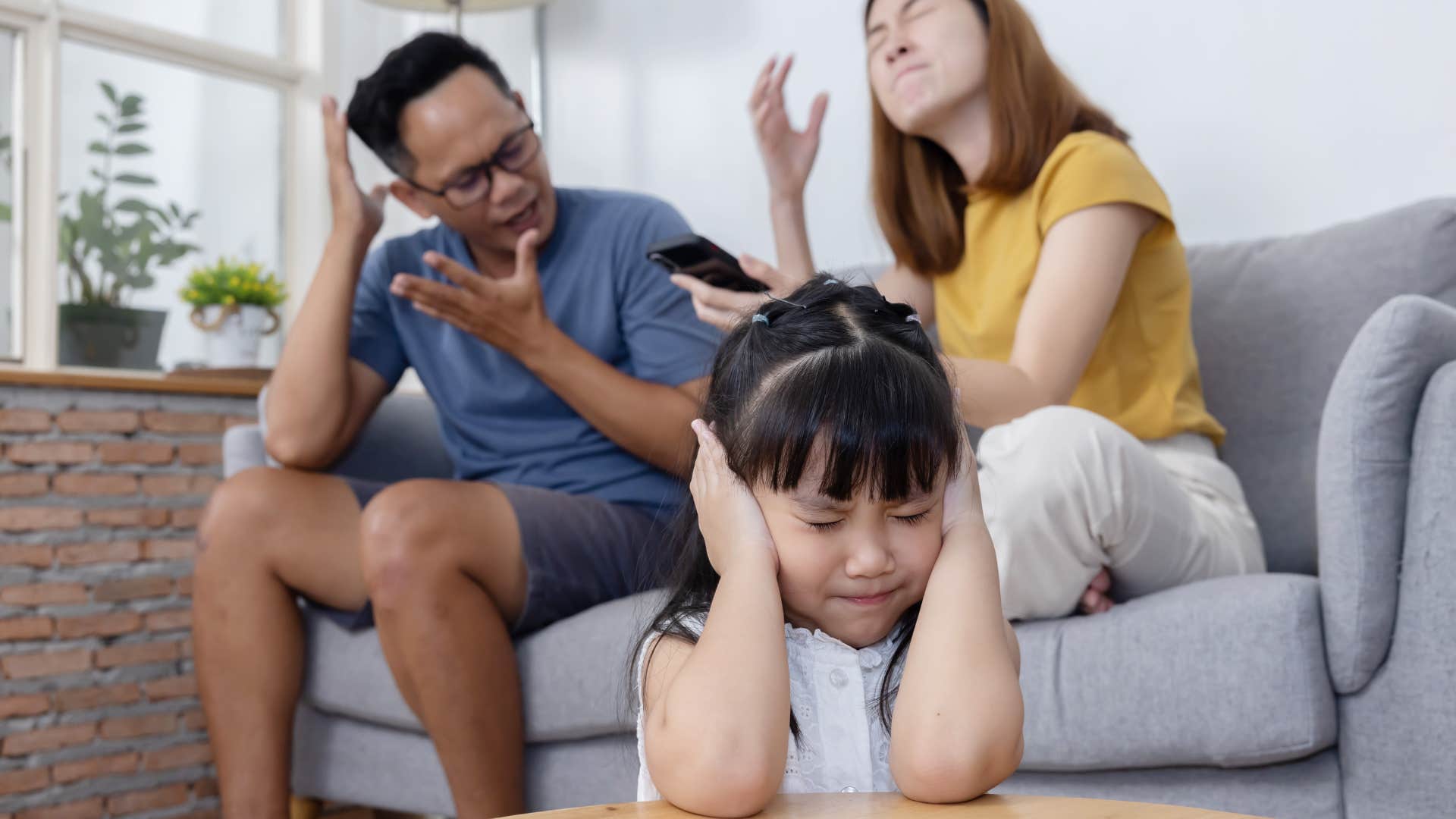 Man saying "we argue about everything" to his wife.