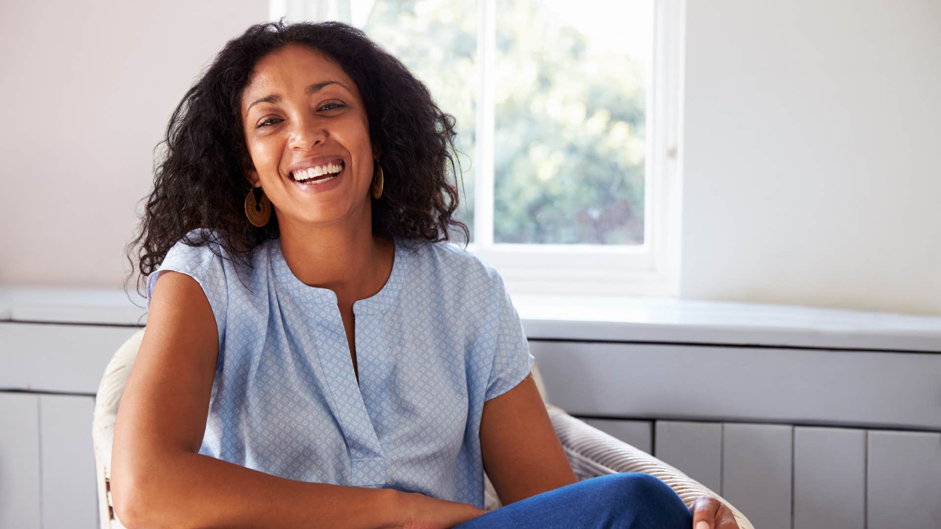smiling confident woman staying in the present