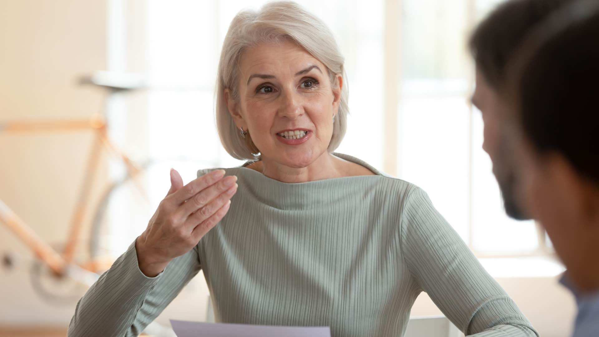 professional confident woman being straightforward with colleague
