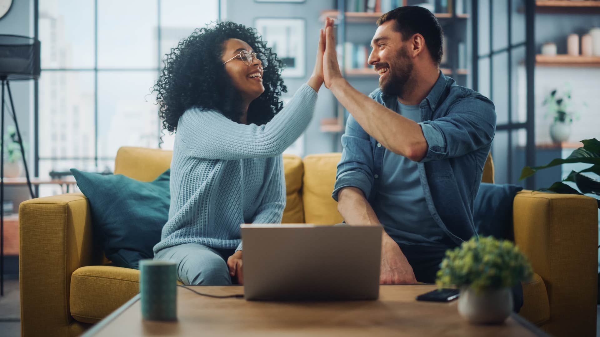 couple in a strong partnership high-fiving