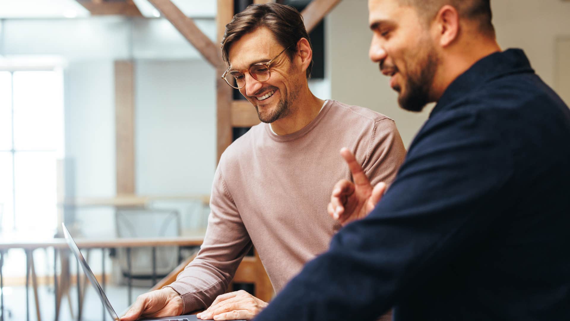 extroverted man filling silence with conversation at work