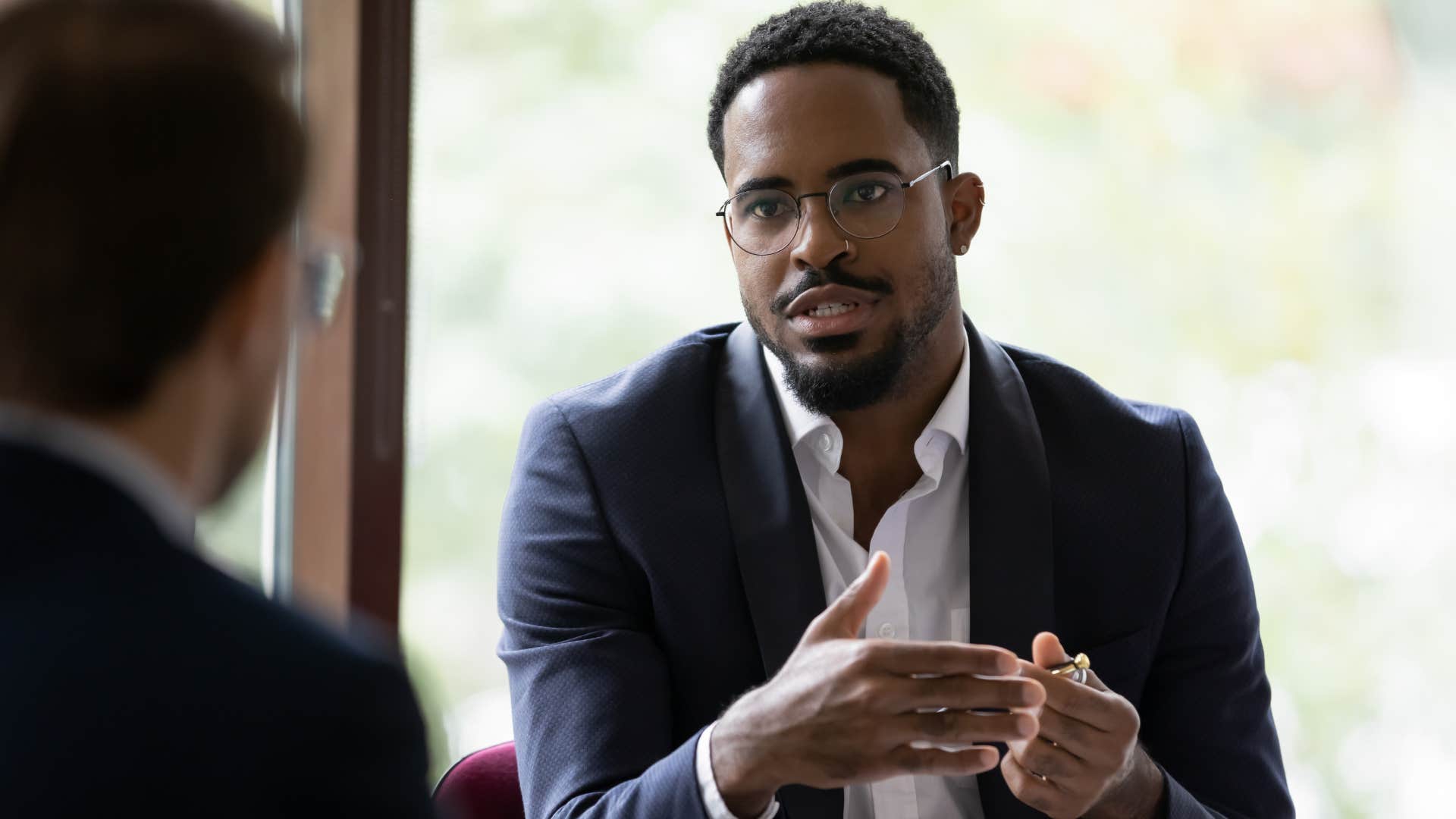 man talking through issues out loud at work